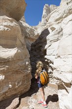 Caucasian girl exploring rock formations