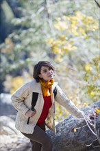 Mixed race hiker exploring forest