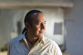 Native American man smiling indoors