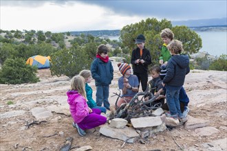Children building campfire on field trip