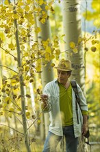 Man exploring autumn forest