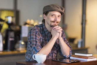 Caucasian man smiling in cafe