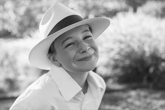 Portrait of smiling Caucasian girl wearing a fedora