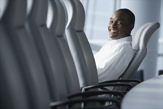 African businessman sitting in conference room