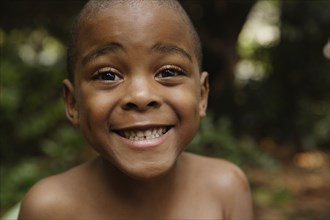 Close up of African American boy smiling