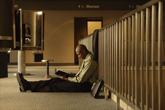 African businessman reading book