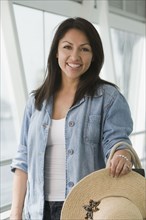 Hispanic woman standing in airport