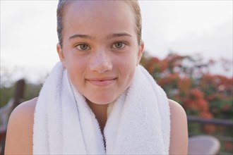 Close up of girl with towel around neck