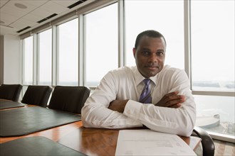 African American businessman sitting in conference room