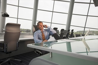 Caucasian businessman working in conference room