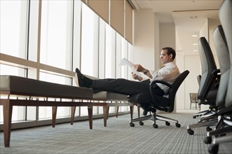 Caucasian businessman working in conference room