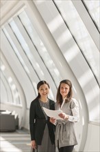 Businesswomen standing in lobby