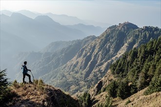Indian man hiking on mountain
