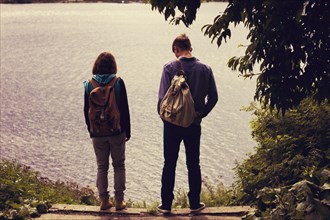 Caucasian couple standing near lake