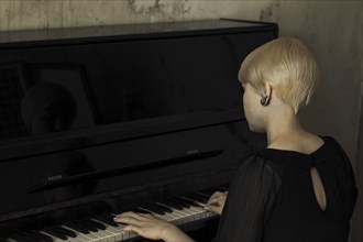 Caucasian woman playing piano