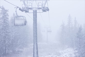 Ski lift on snowy hillside