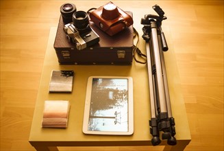 Camera equipment and digital tablet on table