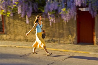 Caucasian woman walking on street