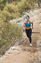 Hispanic runner training in remote area