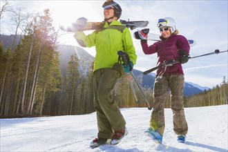 Caucasian couple skiing together