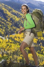 Mixed race woman hiking in mountains