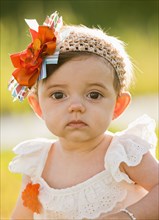 Caucasian baby with fashionable headband