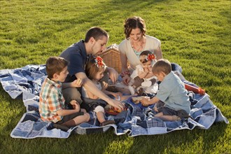 Caucasian family enjoying picnic