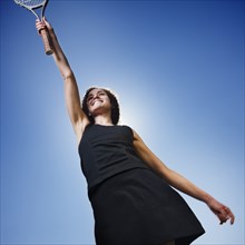 Caucasian woman playing tennis