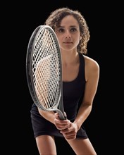 Caucasian tennis player holding tennis racket