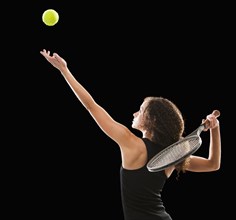 Caucasian tennis player serving the ball
