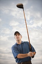 Caucasian golfer playing golf