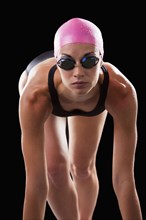 Caucasian swimmer in swim cap and goggles