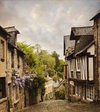 Quaint French houses and cobblestone street