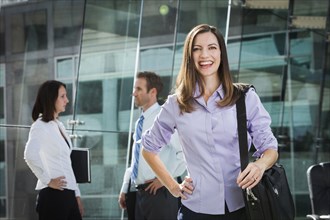 Caucasian businesswoman smiling in office
