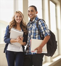 Student couple smiling on campus