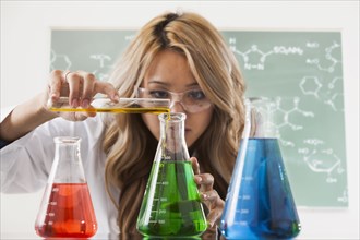 Mixed race student working in chemistry lab