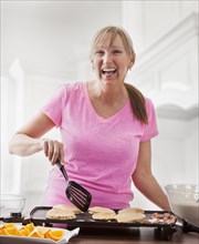 Caucasian woman cooking breakfast