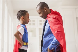Father and son playing superhero
