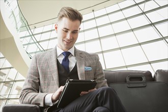 Caucasian businessman using digital tablet