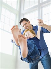 Caucasian father and daughter playing