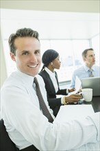 Businessman smiling in meeting