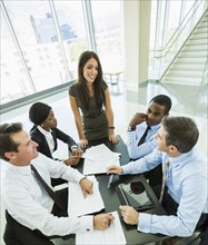 High angle view of business people talking in meeting