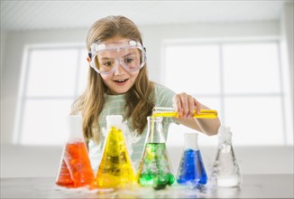Caucasian girl doing science experiment