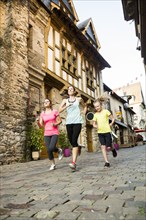 Caucasian women jogging in village