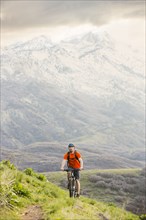 Caucasian man riding mountain bike