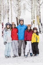 Portrait of smiling Caucasian family on skiing vacation