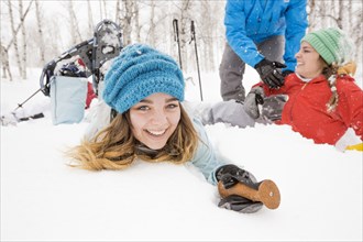 Portrait of smiling Caucasian girl falling in snow