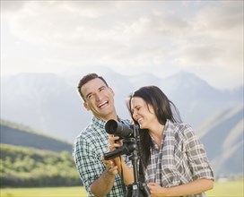Couple with camera laughing