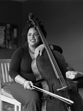 Mixed race woman playing cello