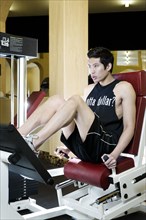 Asian man exercising in health club